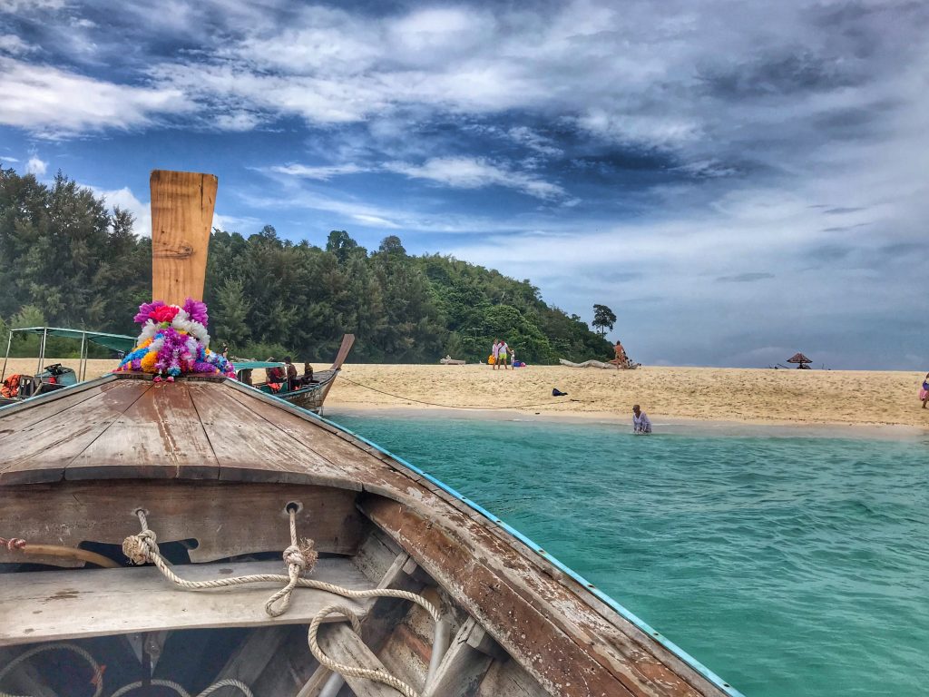 bamboo island water and boat