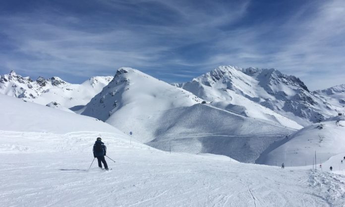 A person skiing in the French Alps