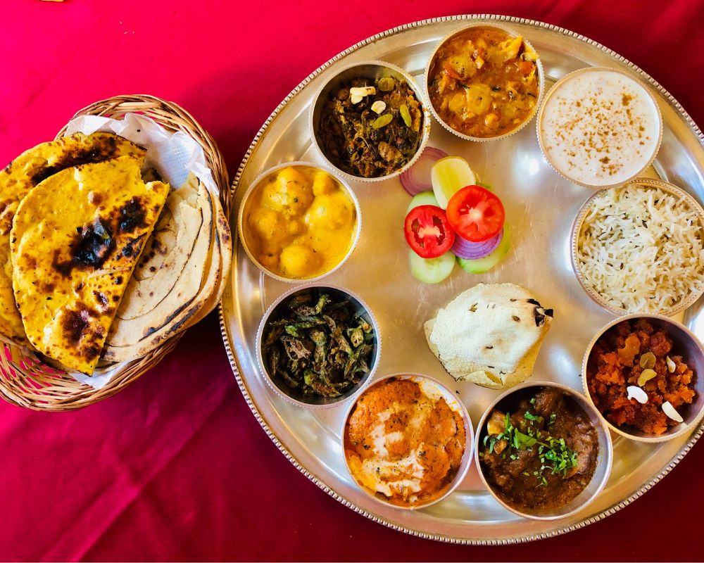 There's an Indian thali - that most local people would eat, maybe different versions but a thali nonetheless. This thali has poppadum, rice, curries, sweet, a salad and a separate basket which holds different kinds of rotis and naan breads