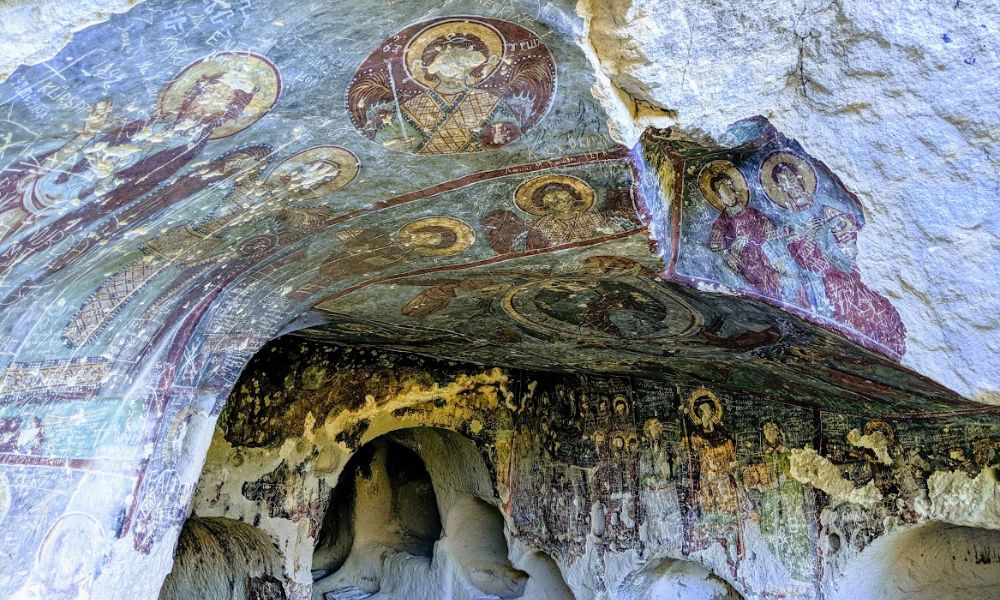 The church and cave interiors in Cappadocia are a sight that you must not miss - this shows various frescos painted inside the caves