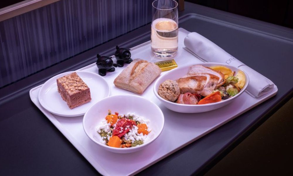 Festive food on Emirates flight - white bowls with tempting food on a white tray