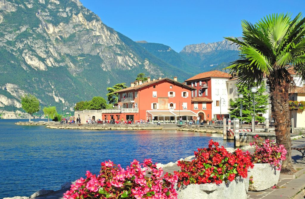 Italy - beautiful and picturesque scene with lake and cottages - on offer with holiday deals 