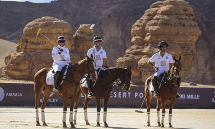 Polo players on their horses at the desert polo in Saudi Arabia