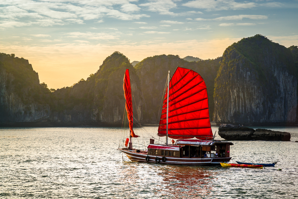 A boat with red sails sailing in Vietnam 