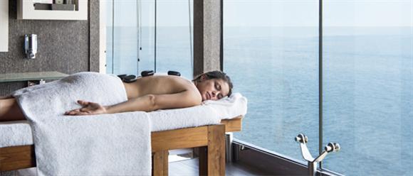 A woman on a relaxing massage table on MSC Cruise ship